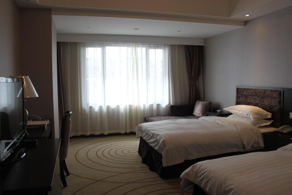 Отель Grand Trustel Mandarin Garden Нанкин Номер фото